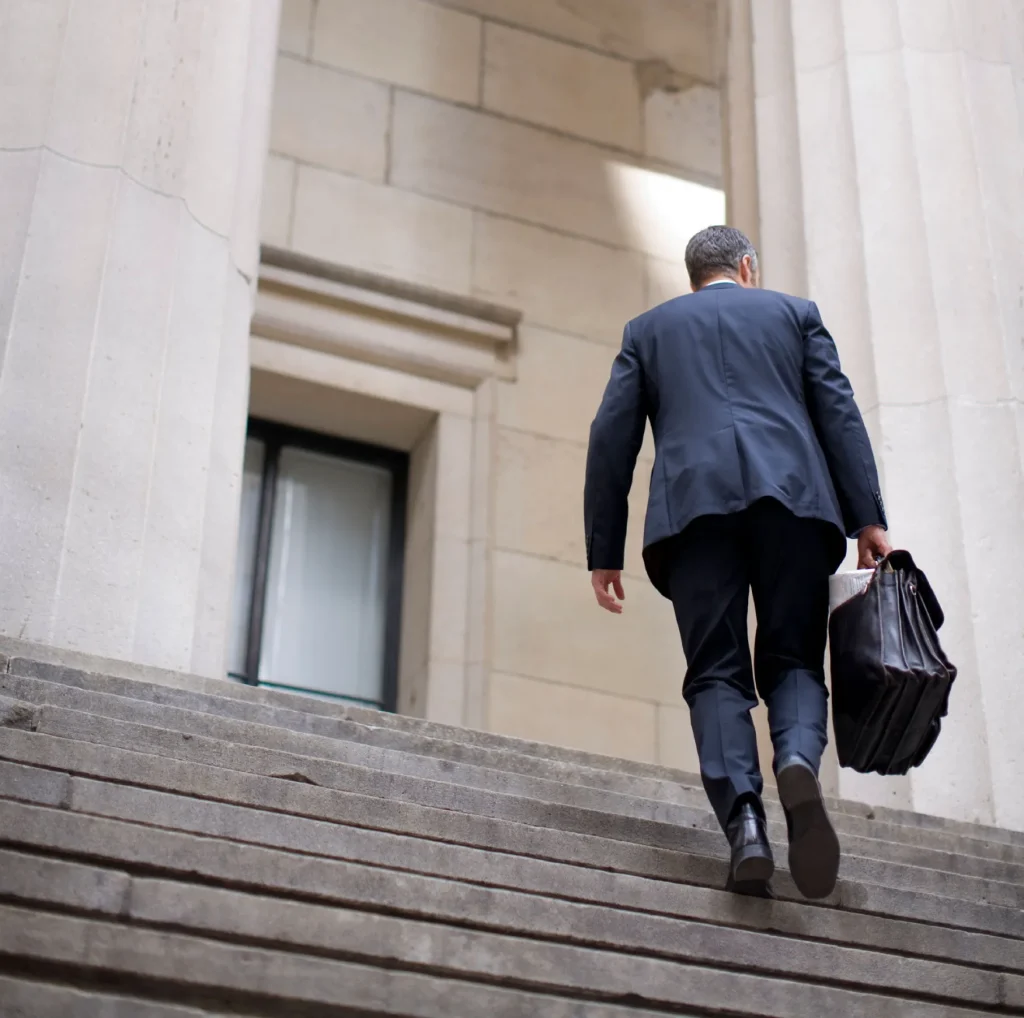product liability lawyer walking up courthouse steps