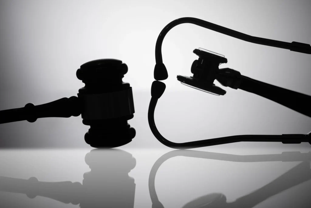 A gavel next to a stethoscope signifying how a misdiagnosis lawyer can help seek compensation for preventable medical injuries.