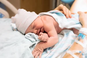 Newborn baby laying on their mother's chest after delivery. If your baby sufferes from Cerebral Palsy due to complications during childbirth resulting from medical negligence, our birth injury lawyers in Baltimore are here to help.