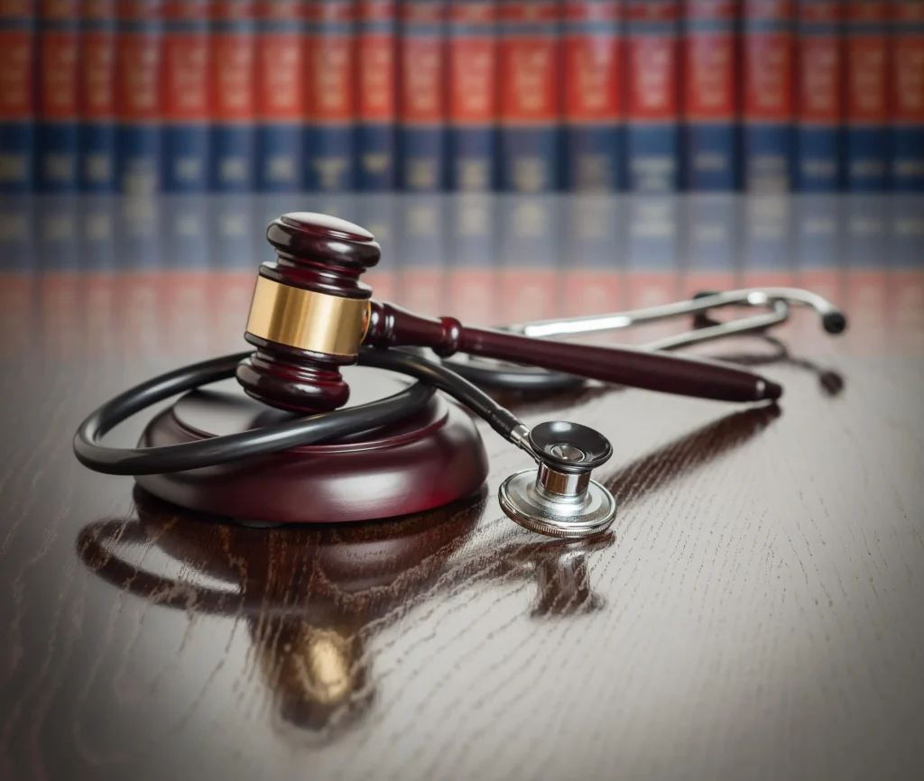 A stethoscope and a gavel intertwined, representing how a Brooklyn park medical malpractice lawyer is a necessary step in pursuing a medical injury claim.